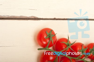 Fresh Cherry Tomatoes On A Cluster Stock Photo