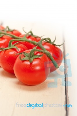 Fresh Cherry Tomatoes On A Cluster Stock Photo