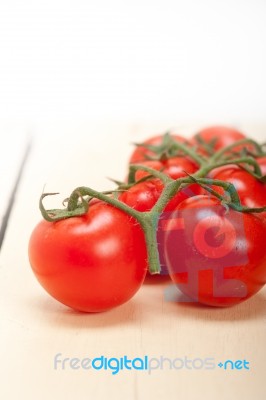 Fresh Cherry Tomatoes On A Cluster Stock Photo