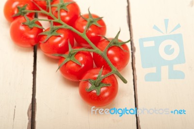 Fresh Cherry Tomatoes On A Cluster Stock Photo