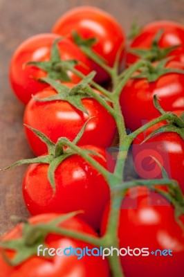 Fresh Cherry Tomatoes On A Cluster Stock Photo