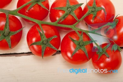 Fresh Cherry Tomatoes On A Cluster Stock Photo