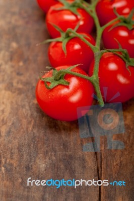 Fresh Cherry Tomatoes On A Cluster Stock Photo