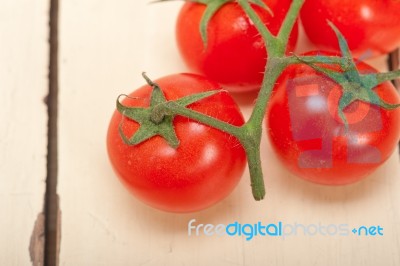 Fresh Cherry Tomatoes On A Cluster Stock Photo