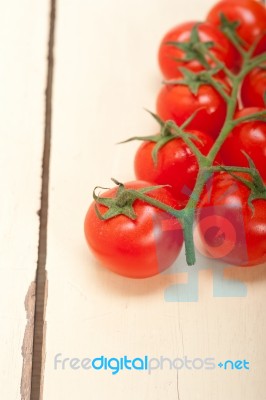 Fresh Cherry Tomatoes On A Cluster Stock Photo