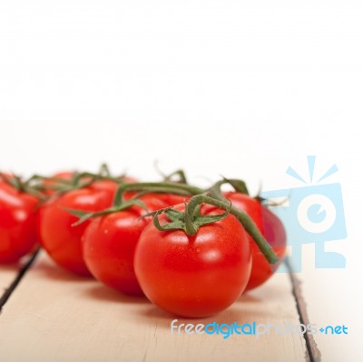 Fresh Cherry Tomatoes On A Cluster Stock Photo