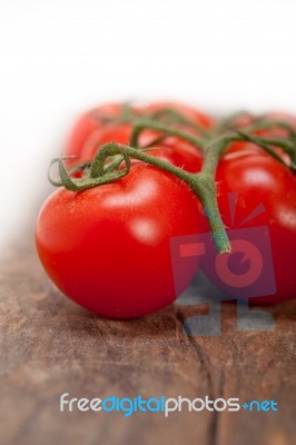 Fresh Cherry Tomatoes On A Cluster Stock Photo