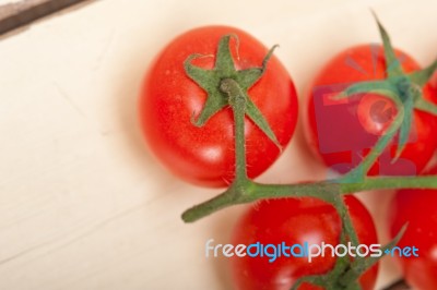 Fresh Cherry Tomatoes On A Cluster Stock Photo