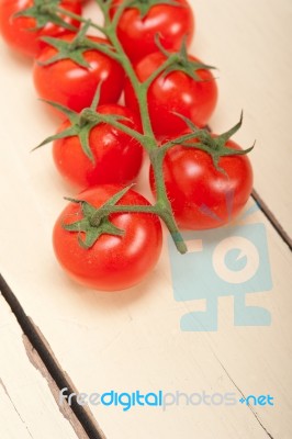 Fresh Cherry Tomatoes On A Cluster Stock Photo