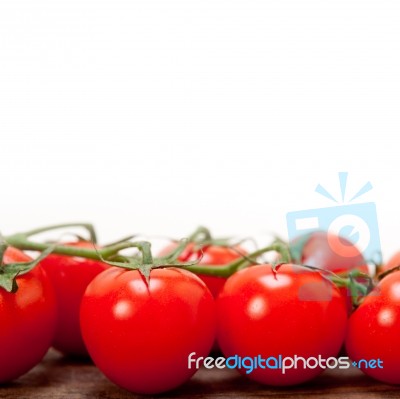 Fresh Cherry Tomatoes On A Cluster Stock Photo