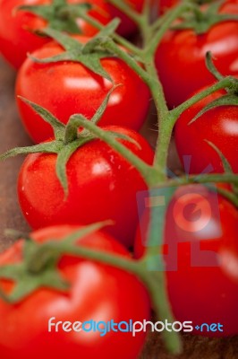 Fresh Cherry Tomatoes On A Cluster Stock Photo