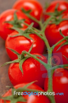 Fresh Cherry Tomatoes On A Cluster Stock Photo