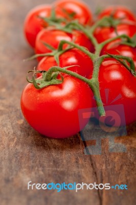 Fresh Cherry Tomatoes On A Cluster Stock Photo