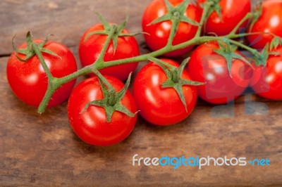 Fresh Cherry Tomatoes On A Cluster Stock Photo