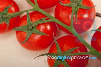 Fresh Cherry Tomatoes On A Cluster Stock Photo