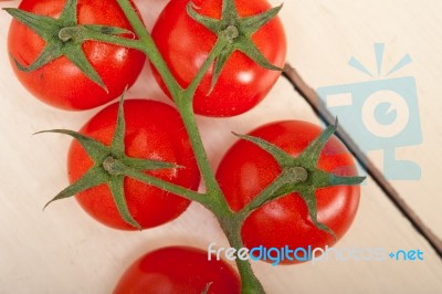 Fresh Cherry Tomatoes On A Cluster Stock Photo