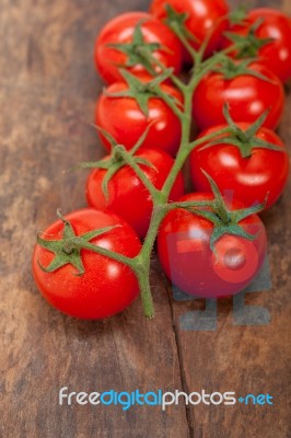 Fresh Cherry Tomatoes On A Cluster Stock Photo