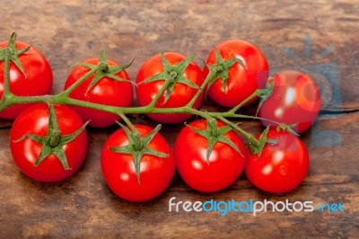 Fresh Cherry Tomatoes On A Cluster Stock Photo