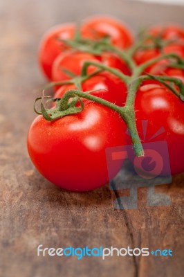 Fresh Cherry Tomatoes On A Cluster Stock Photo