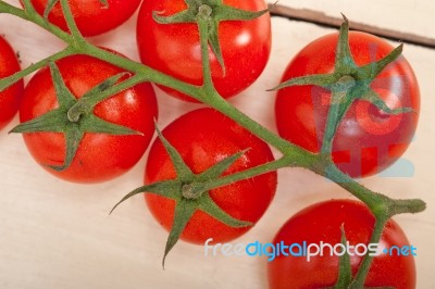 Fresh Cherry Tomatoes On A Cluster Stock Photo