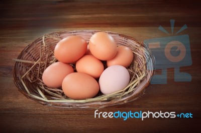 Fresh Eggs In Bamboo Basket Stock Photo