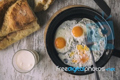 Fresh Fried Eggs On Oil Stock Photo