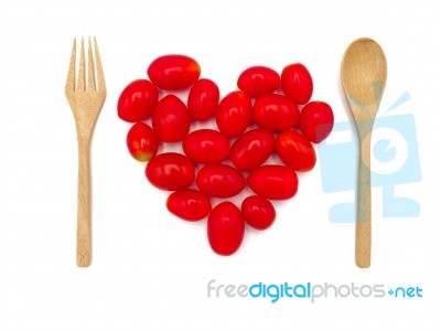 Fresh Grape Or Cherry Tomato With Wooden Spoon On White Backgrou… Stock Photo