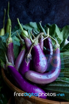 Fresh Healthy Eggplants On Dark Background Stock Photo