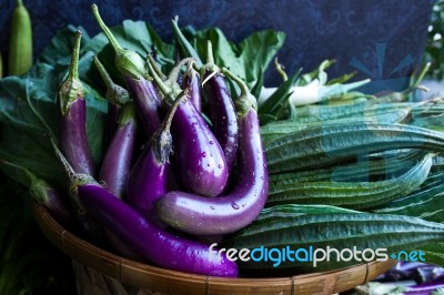 Fresh Healthy Eggplants On Dark Background Stock Photo