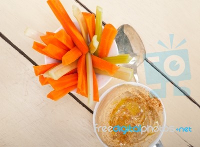 Fresh Hummus Dip With Raw Carrot And Celery Stock Photo