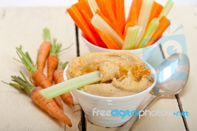 Fresh Hummus Dip With Raw Carrot And Celery Stock Photo