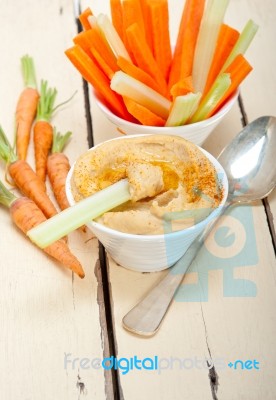 Fresh Hummus Dip With Raw Carrot And Celery Stock Photo