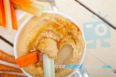 Fresh Hummus Dip With Raw Carrot And Celery Stock Photo