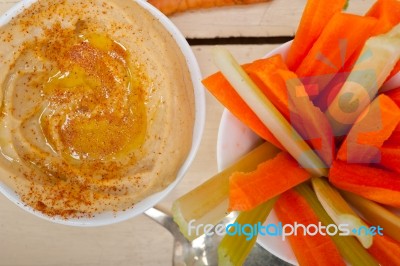 Fresh Hummus Dip With Raw Carrot And Celery Stock Photo