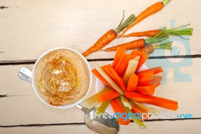 Fresh Hummus Dip With Raw Carrot And Celery Stock Photo