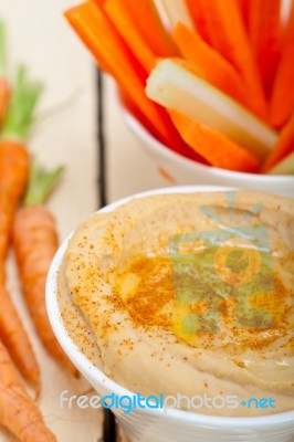 Fresh Hummus Dip With Raw Carrot And Celery Stock Photo