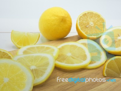 Fresh Lemon Slice On White Wood Background Stock Photo