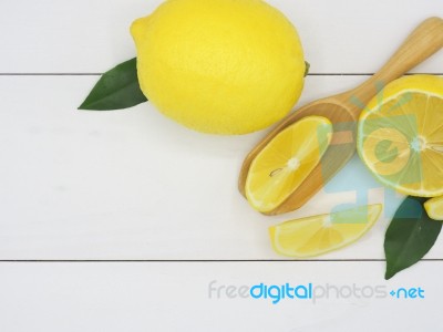 Fresh Lemon Slice On White Wood Background Stock Photo