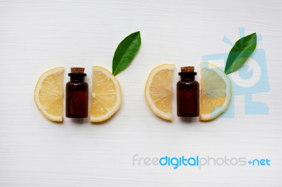 Fresh Lemon Slices With Lemon Essential Oil  Stock Photo