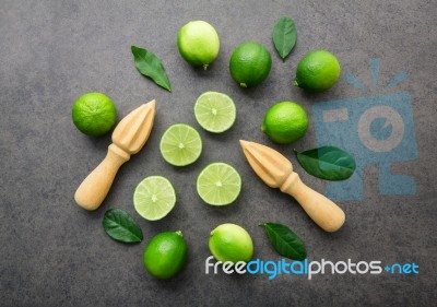 Fresh Limes And Wooden Juicer On White Background. Top View With… Stock Photo