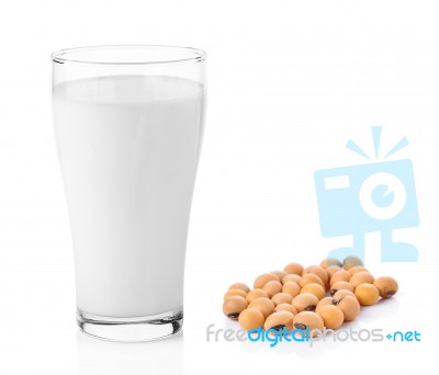 Fresh Milk In The Glass With Soy Beans On White Background Stock Photo