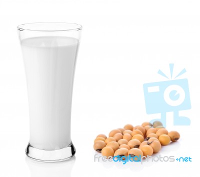 Fresh Milk In The Glass With Soy Beans On White Background Stock Photo