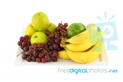 Fresh Mixed Fruit In Plate On White Background Stock Photo