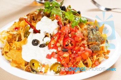 Fresh Nachos And Vegetable Salad With Meat Stock Photo