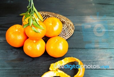 Fresh Orange And Leaf On Basket,  Group Of Mandarin Orange On Bl… Stock Photo