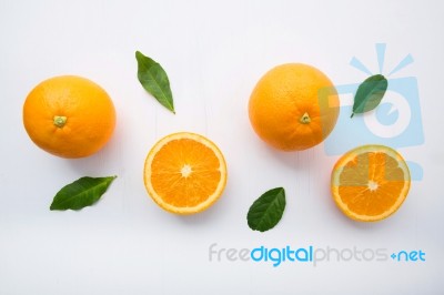 Fresh Orange Citrus Fruit On Wooden White Background. Top View Stock Photo