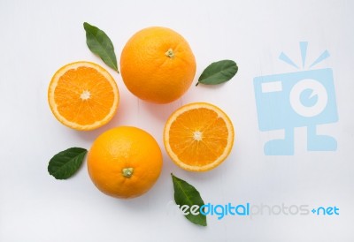 Fresh Orange Citrus Fruit On Wooden White Background. Top View Stock Photo