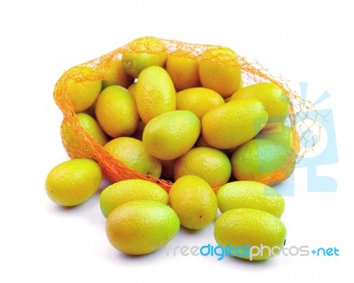 Fresh Orange In Plastic Netting Sack On White Background Stock Photo