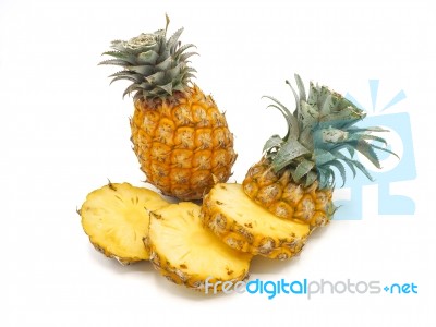 Fresh Pineapple Fruit With Slices On White Background Stock Photo