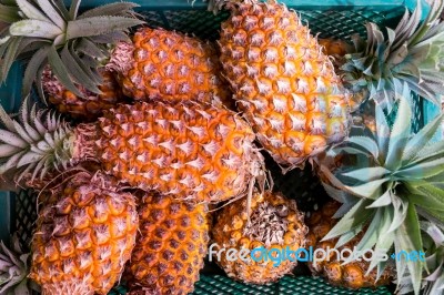 Fresh Pineapple In Basket Stock Photo